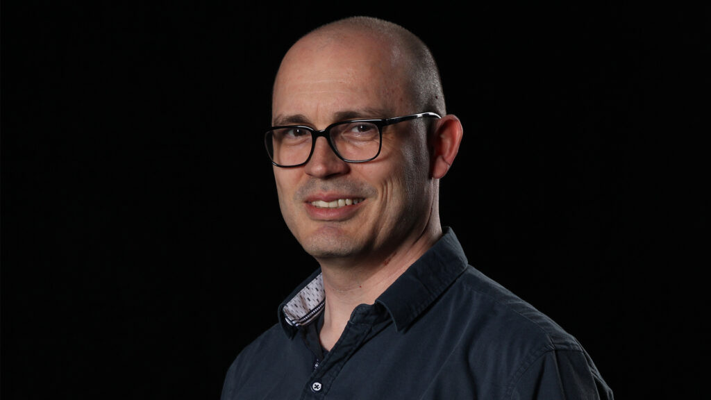 Portrait of Kevin Alexander, creator of PKU Journal. He writes about PKU, newborn screening, rare disease, and mental health advocacy.