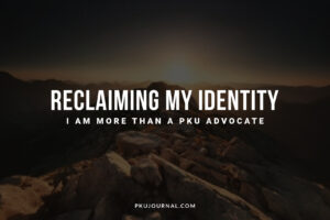 Wide-angle dark mountain peak at dawn with the text: "Reclaiming My Identity. I am more than a PKU advocate."
